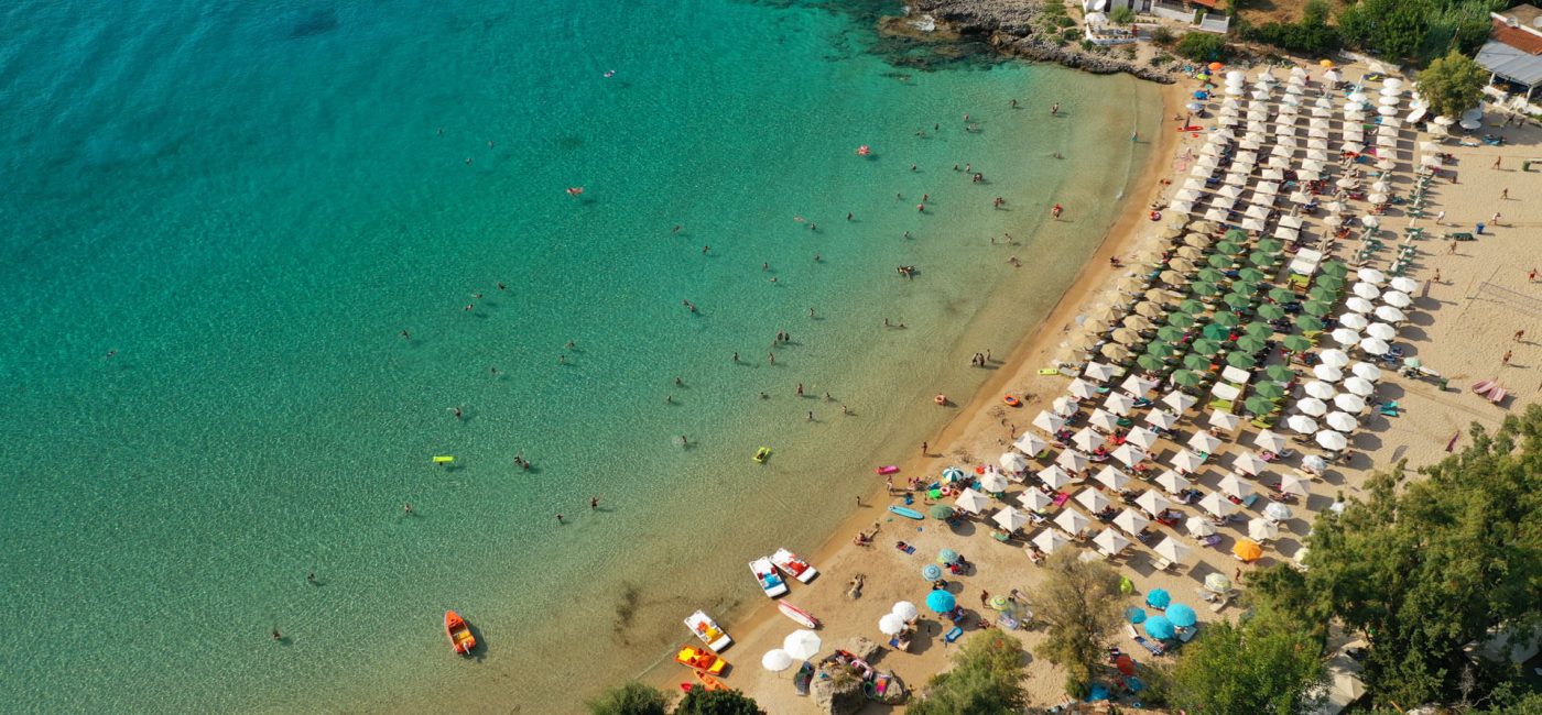 Aerial-drone-photo-of-famous-organised-sandy-paradise-beach-of-Kalogria-in-the-heart-of-Messinian-Mani-next-to-iconic-village-of-Stoupa,-Peloponnese,-Greece